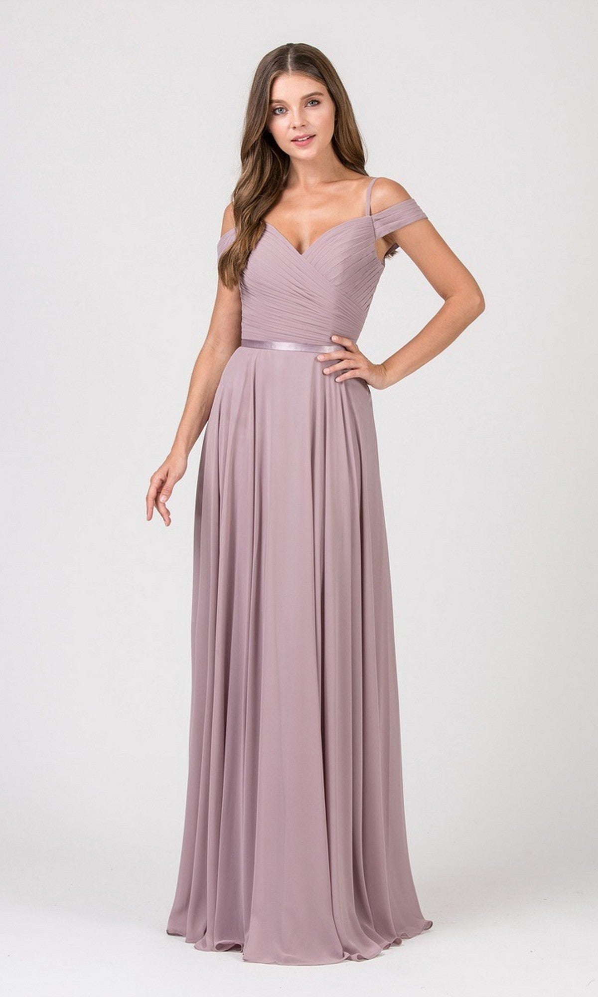A woman stands against a plain light background wearing the Eureka 7611 Long Prom Dress in lilac, featuring an off-the-shoulder chiffon design with a ruched fitted bodice and flowing skirt.